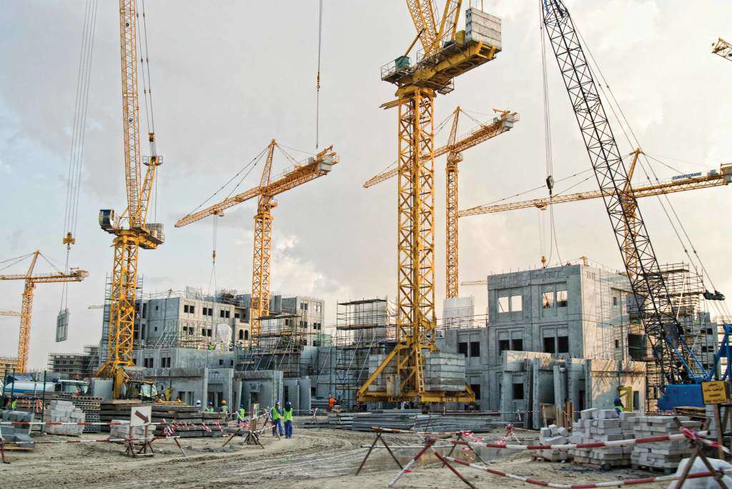 Wall-panels-gallery-8 Precast concrete wall panels used in residential building construction with cranes