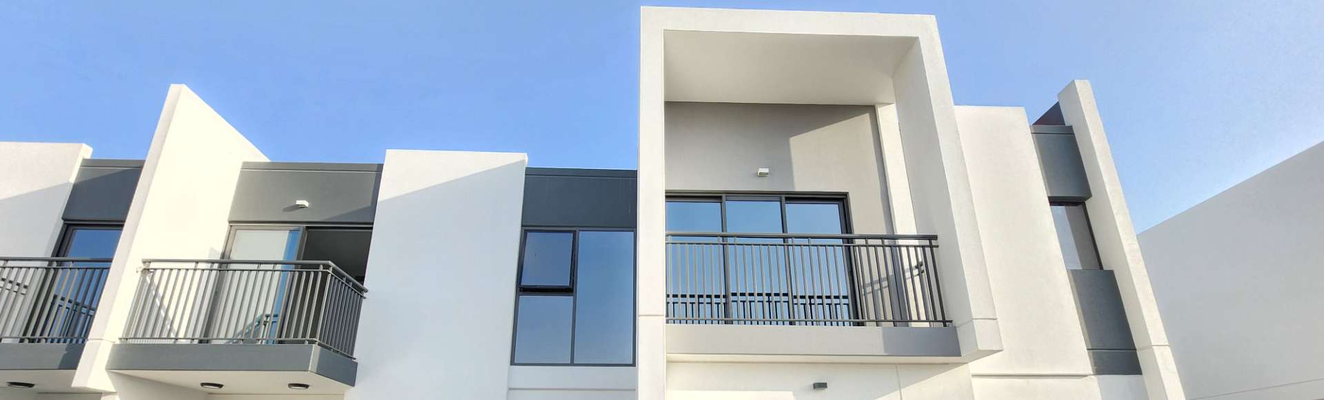 Precast wall panels used in modern residential building facade with balconies and window openings