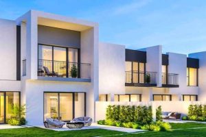 Wall panels creating sleek facade for modern townhouse development with large windows and balconies