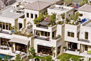 Decorative wall panels featuring Islamic design elements in upscale villa development with pools