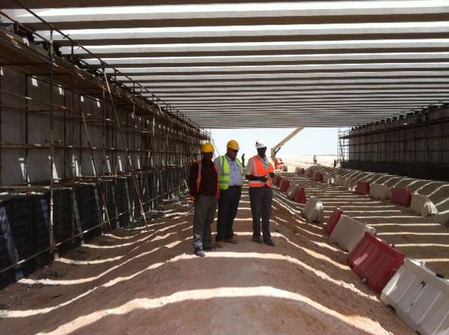 I Girder beams ( Weight 53 ton )-5 Engineers inspecting precast beams and columns framework at industrial construction project site