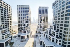 the Makers District residential towers in Abu Dhabi featuring modern geometric architecture and skyline views