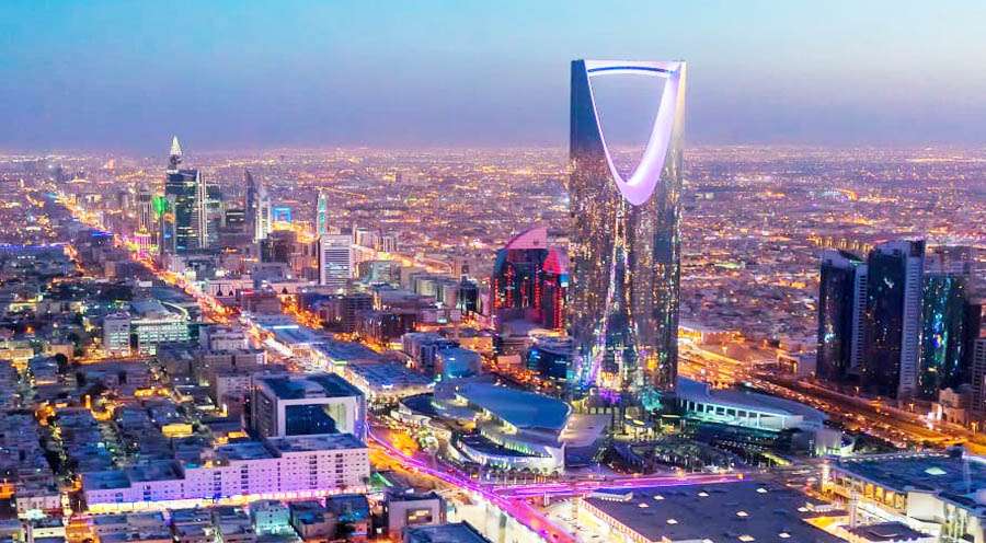 a wide angle image of Riyadh city in Saudi Arabia capturing the buildings and busy traffic through the streets